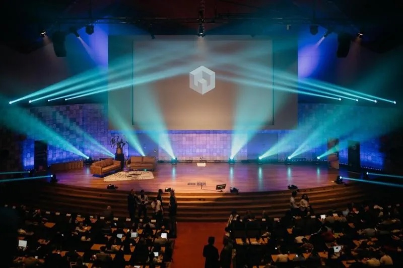 Wide view of the Erasmus Tech Community stage and audience