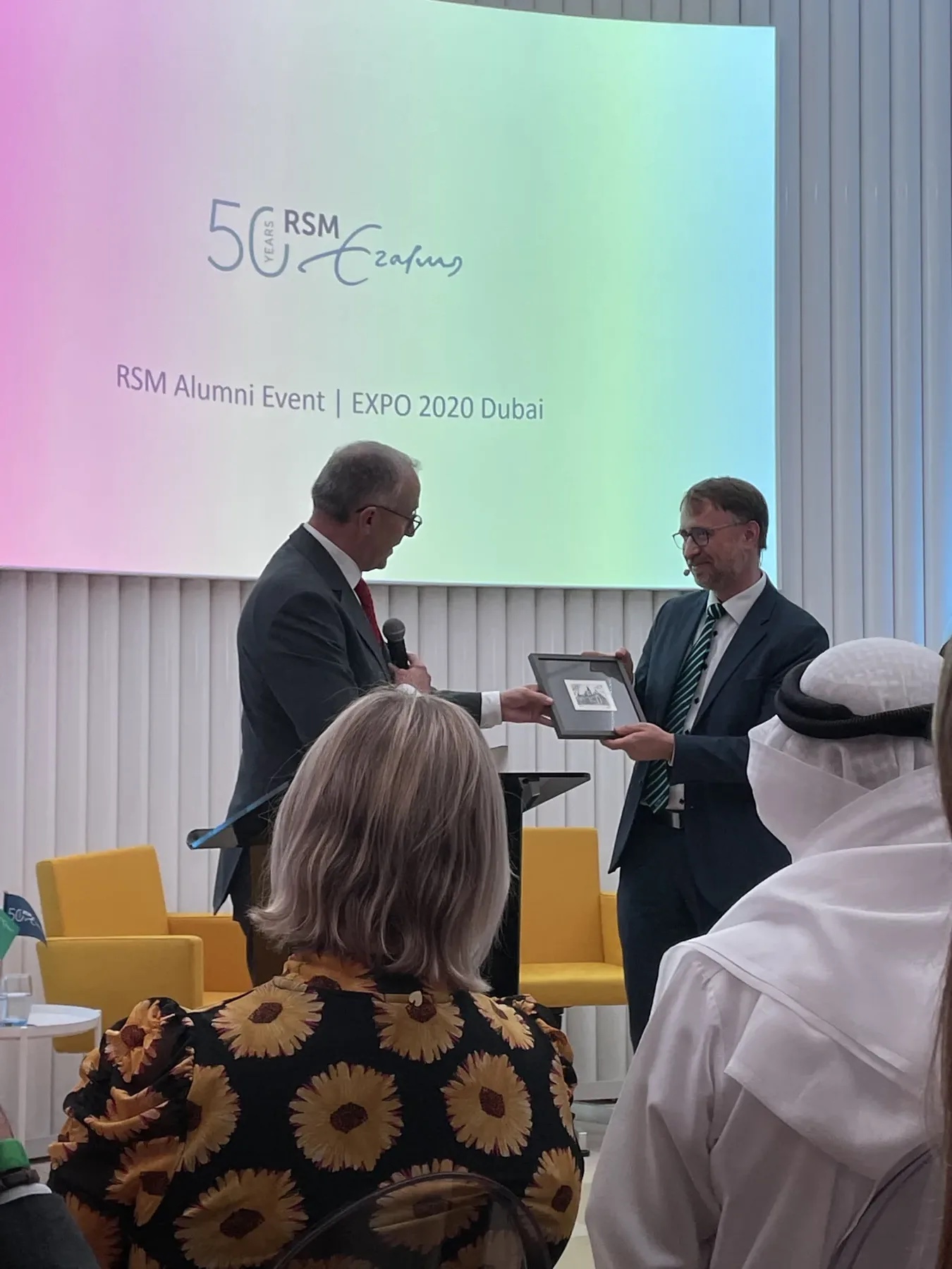 RSM alumni event presentation and plaque handover in Dubai