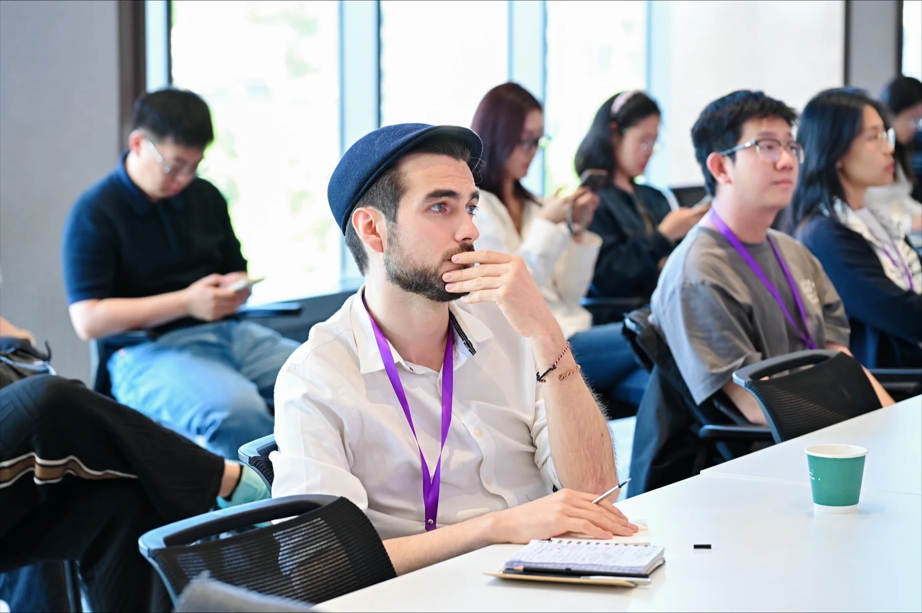 Magnus van Haaren listening in the Tsinghua workshop audience