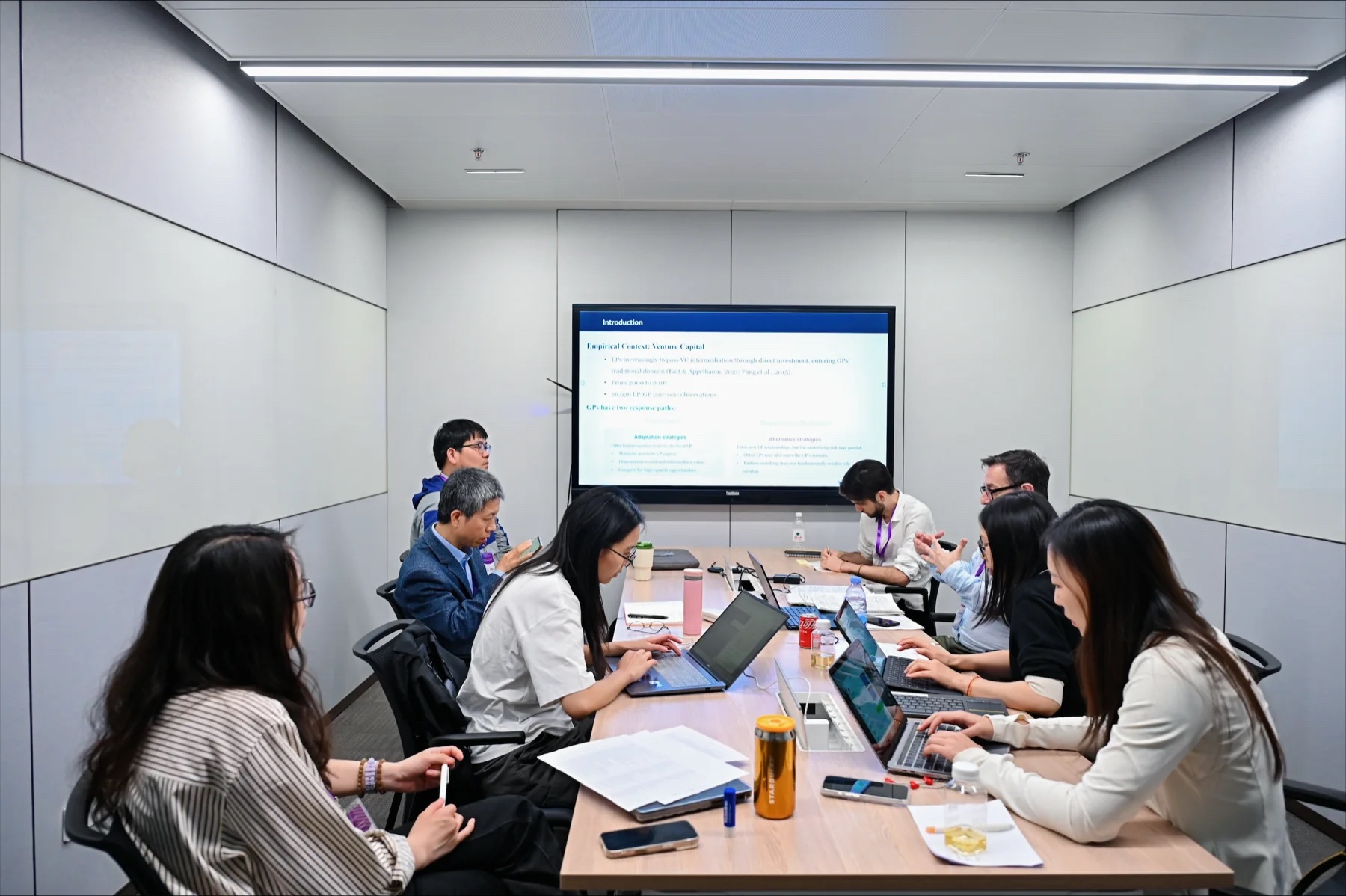 Paper-development workshop session at Tsinghua University